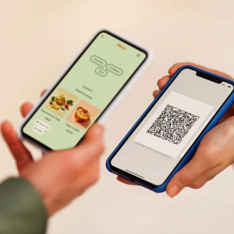 A customer scanning a QR code to open a menu