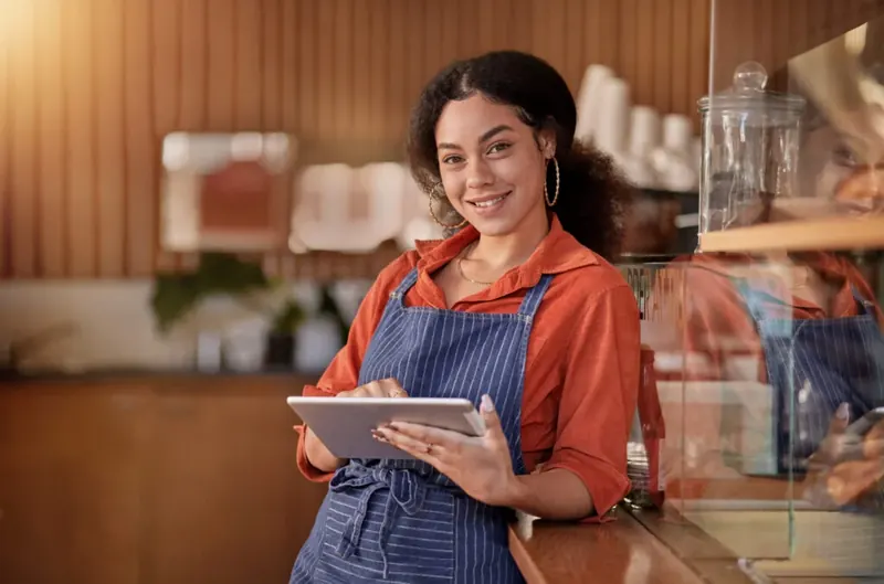 Restaurant staff member using a tablet